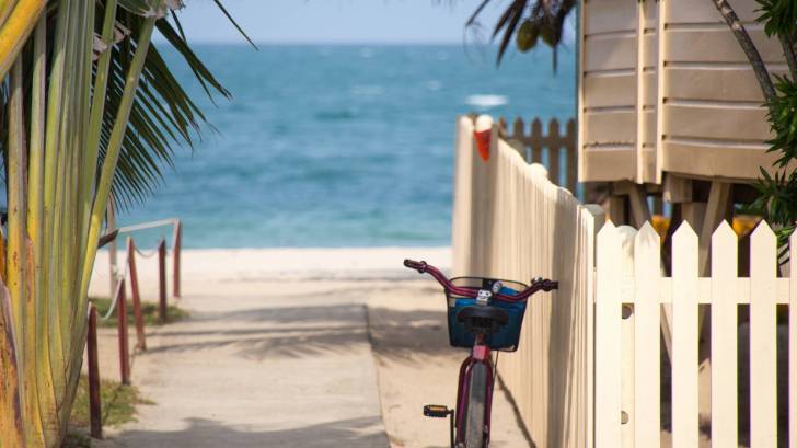 bike resting next to a beach house in the florida keys