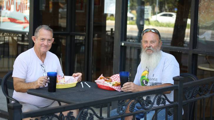 older men at a cafe outside