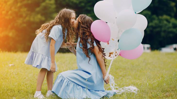 Mom and daughter with balloons