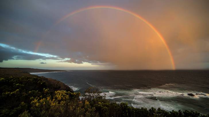 rainbow over the australian beach