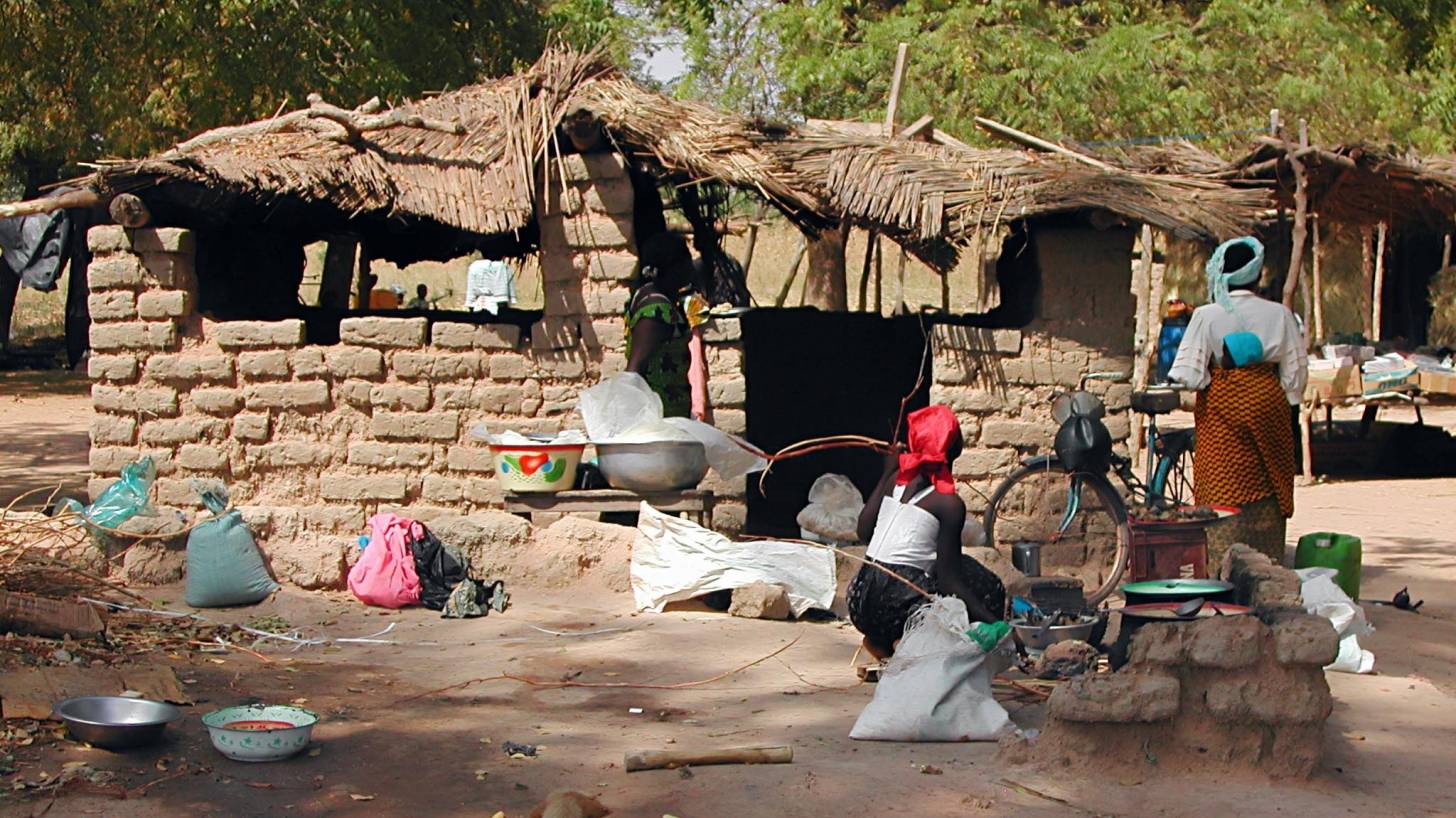 Burkina Faso women and clay homes