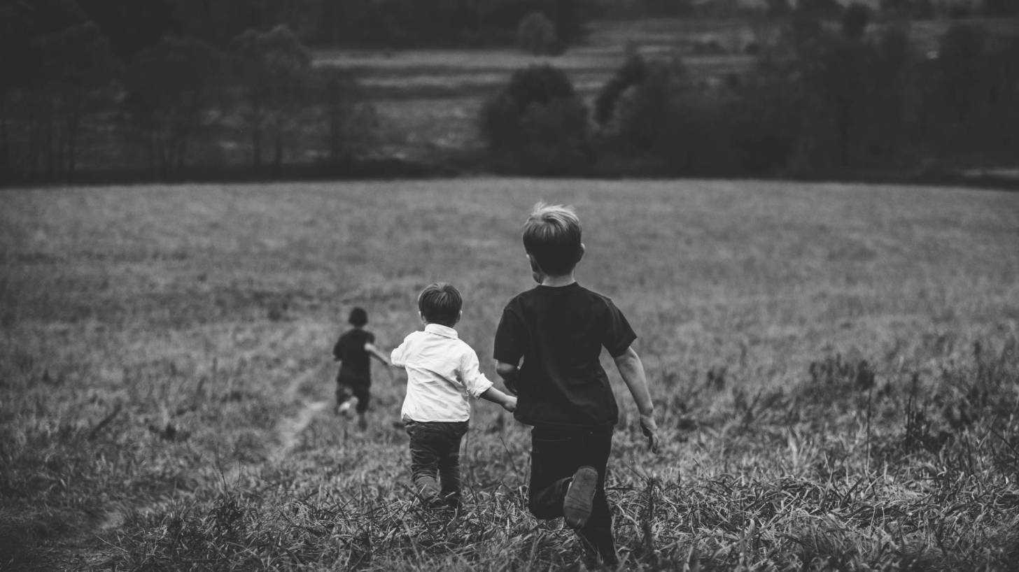 boys running in a field