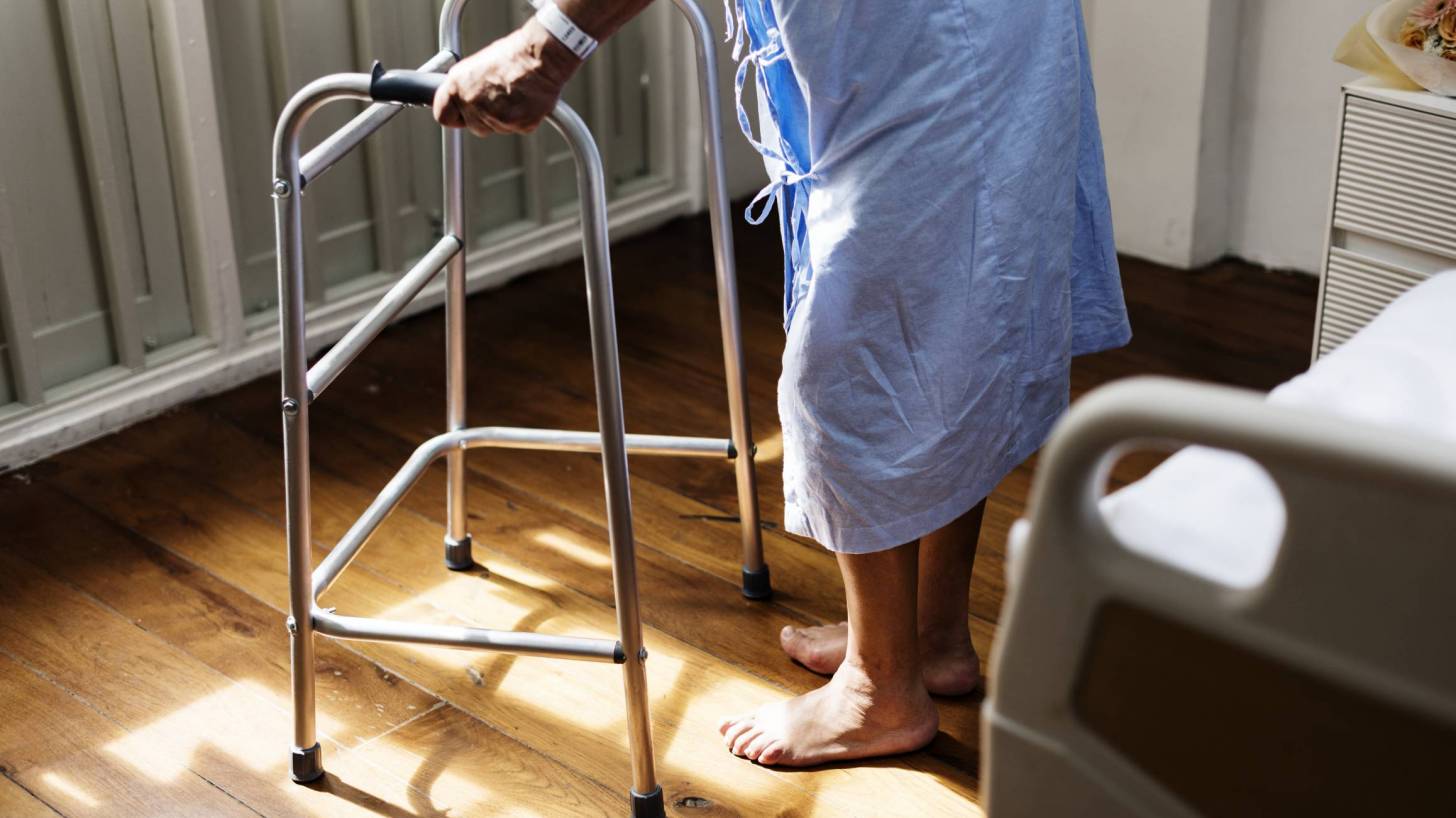 elderly patient in hospital gown