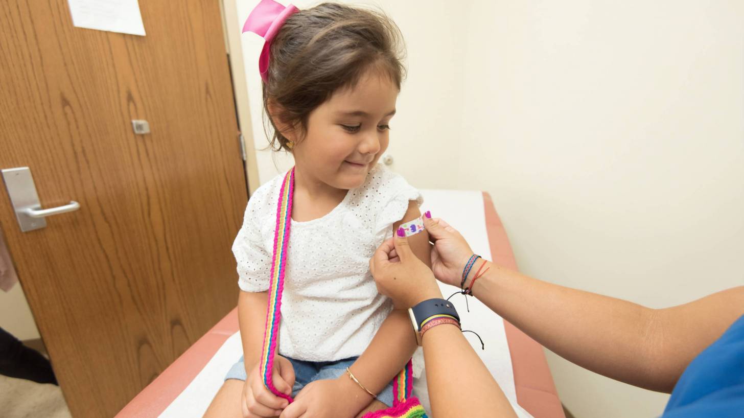 little girl getting a vaccine