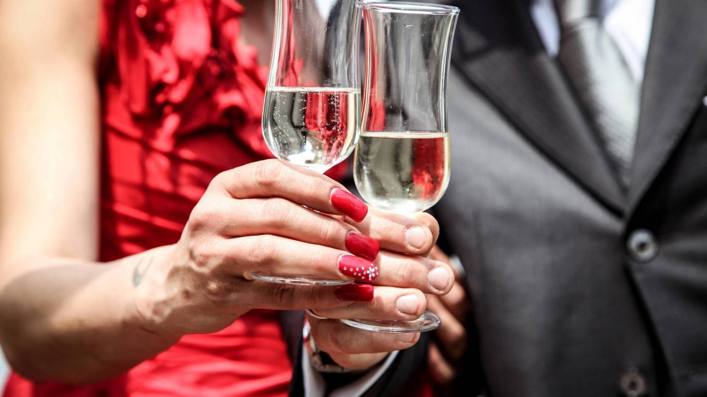 couple celebrating with champagne flutes