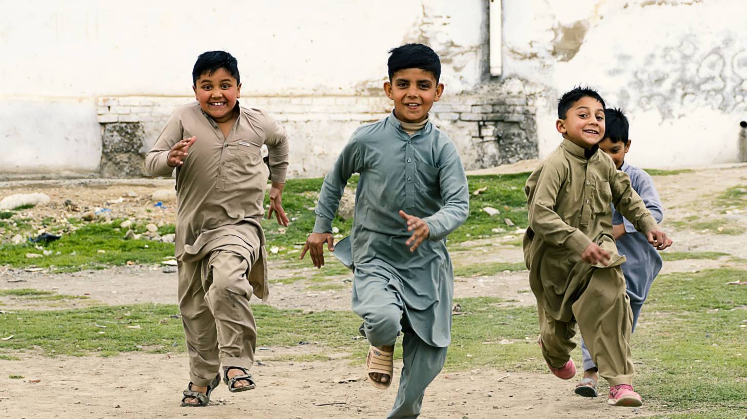 pakistani boys running happy