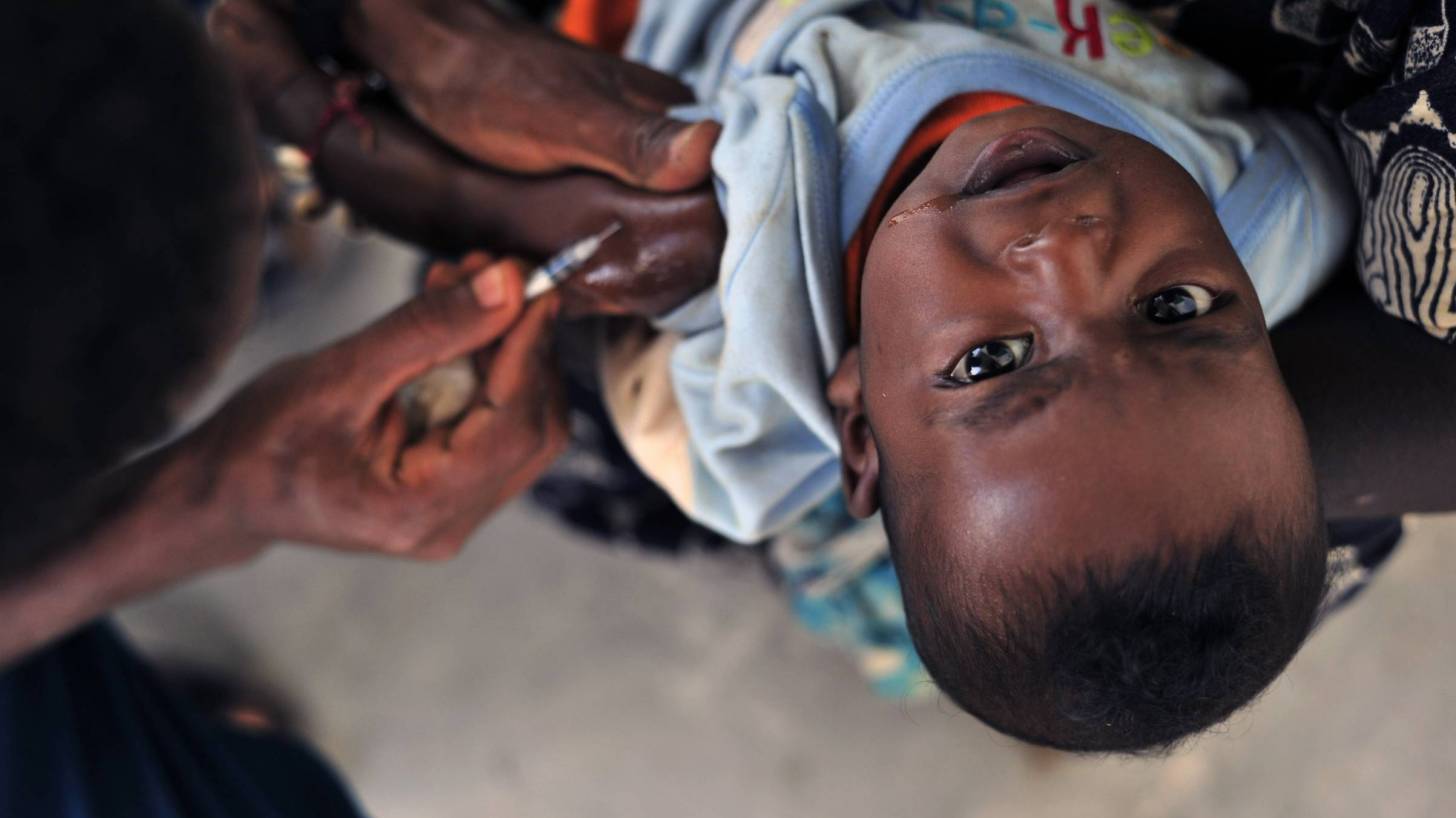 young african boy getting a vaccination