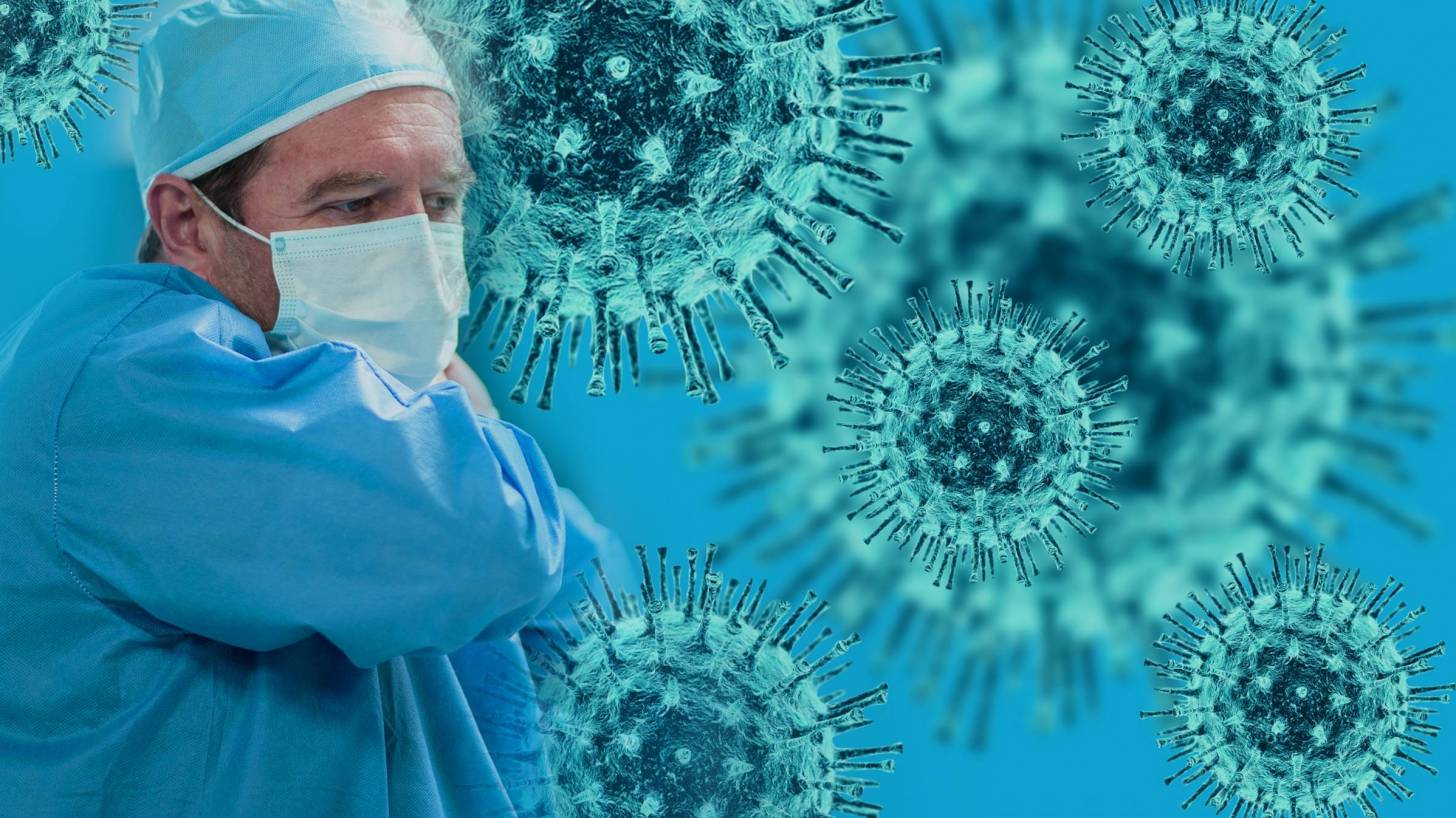 doctor with mask on and the coronavirus depicted