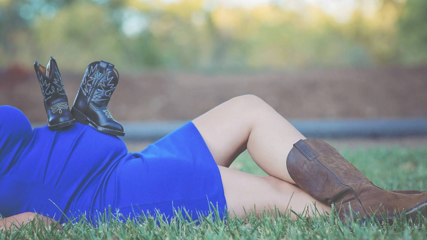 Mom, pregnant with a boy, cowboy boots healthy
