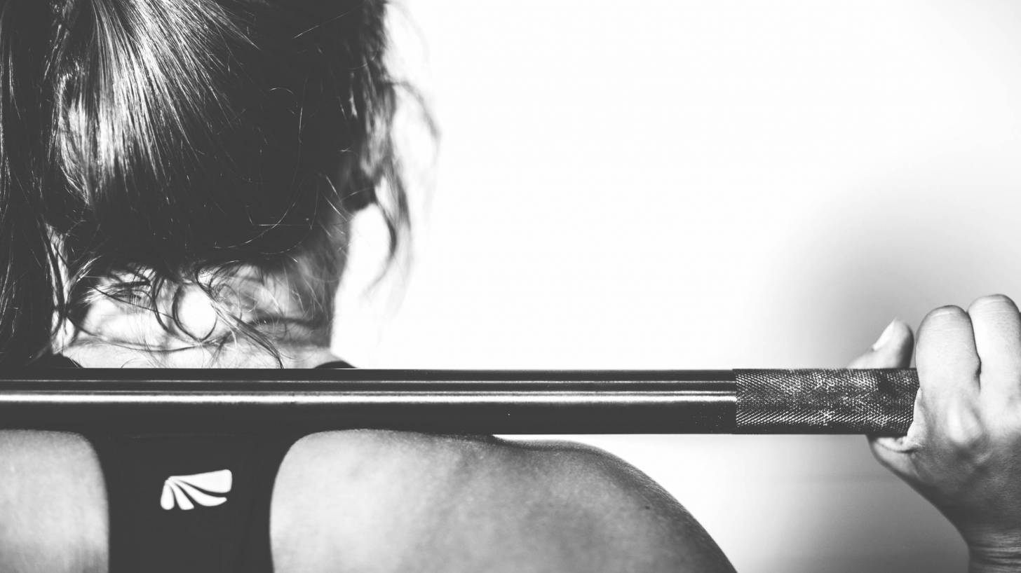 strong woman lifting weights keeping healthy