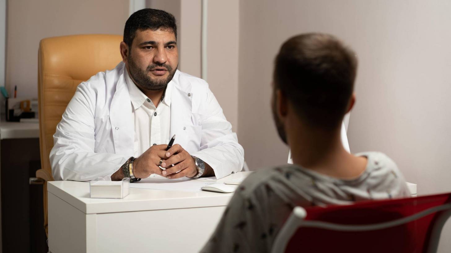 doctor speaking with patient