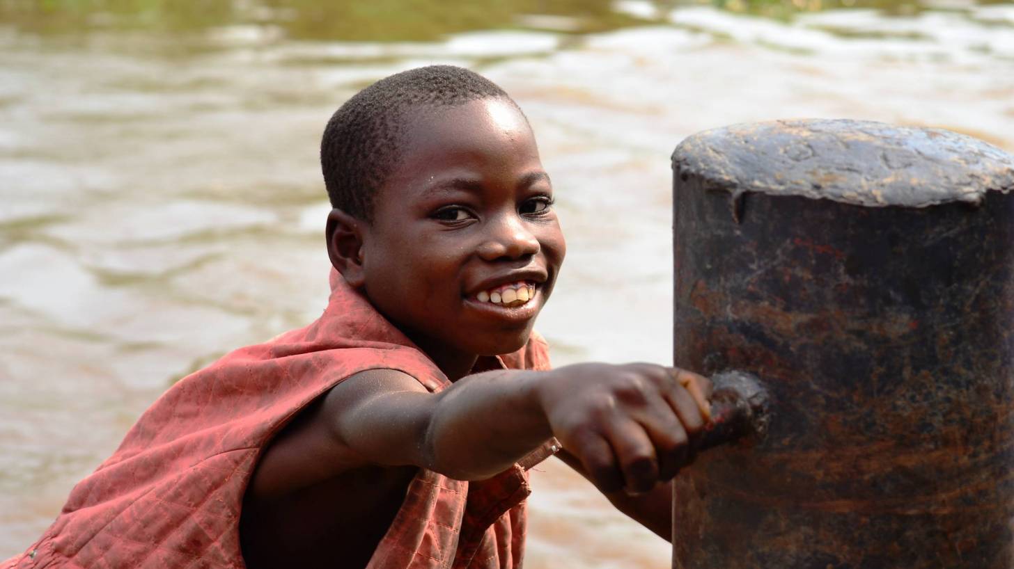DRC young african boy on the river