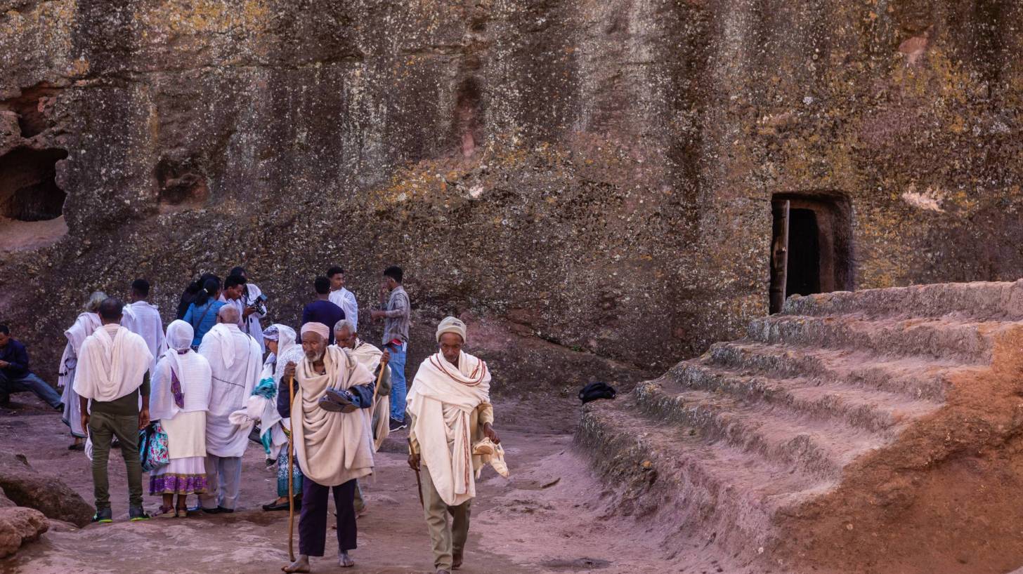 ethiopians outside an ancient building