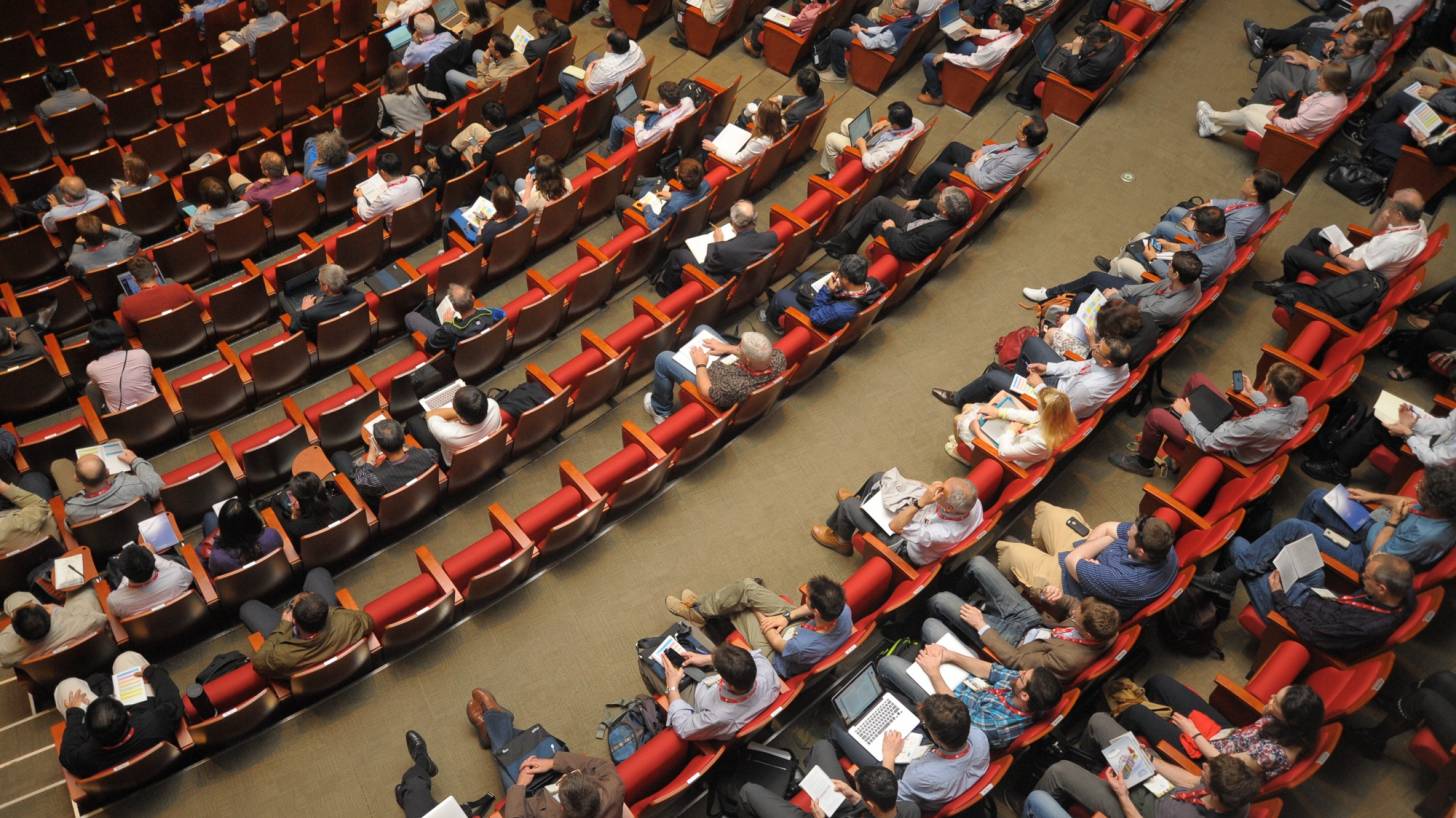 auditorium of people at a meeting