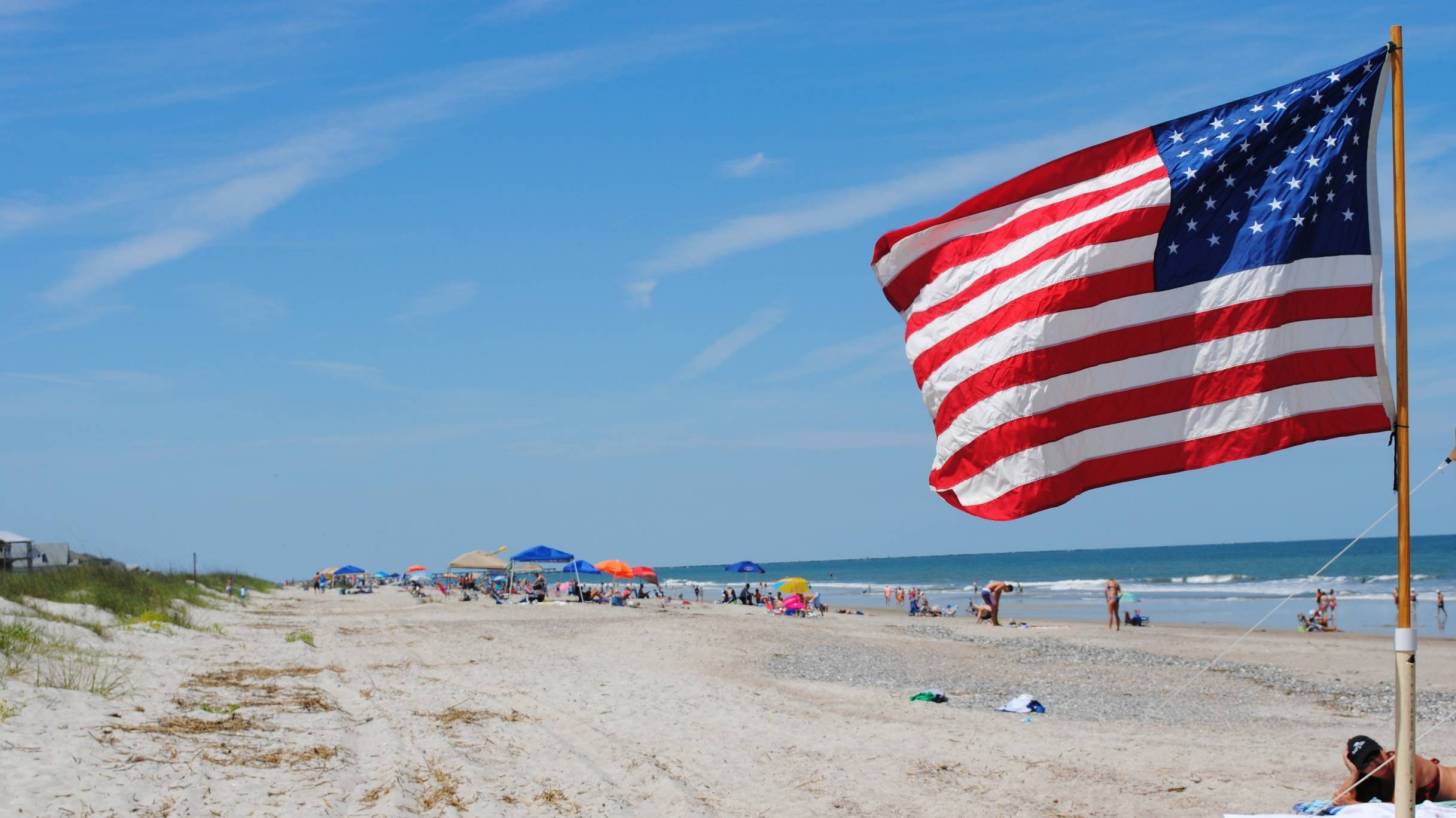 july 4th on the beach with american flag