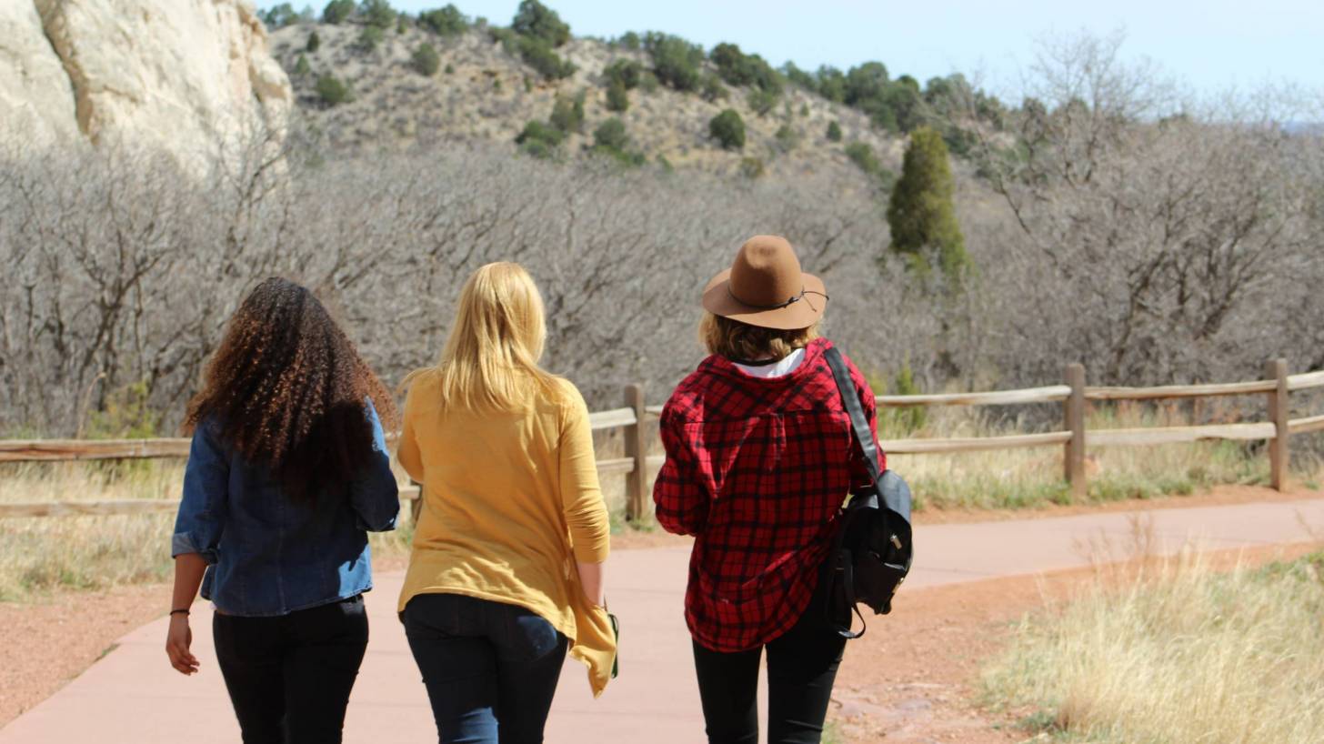 women friends walking on trail
