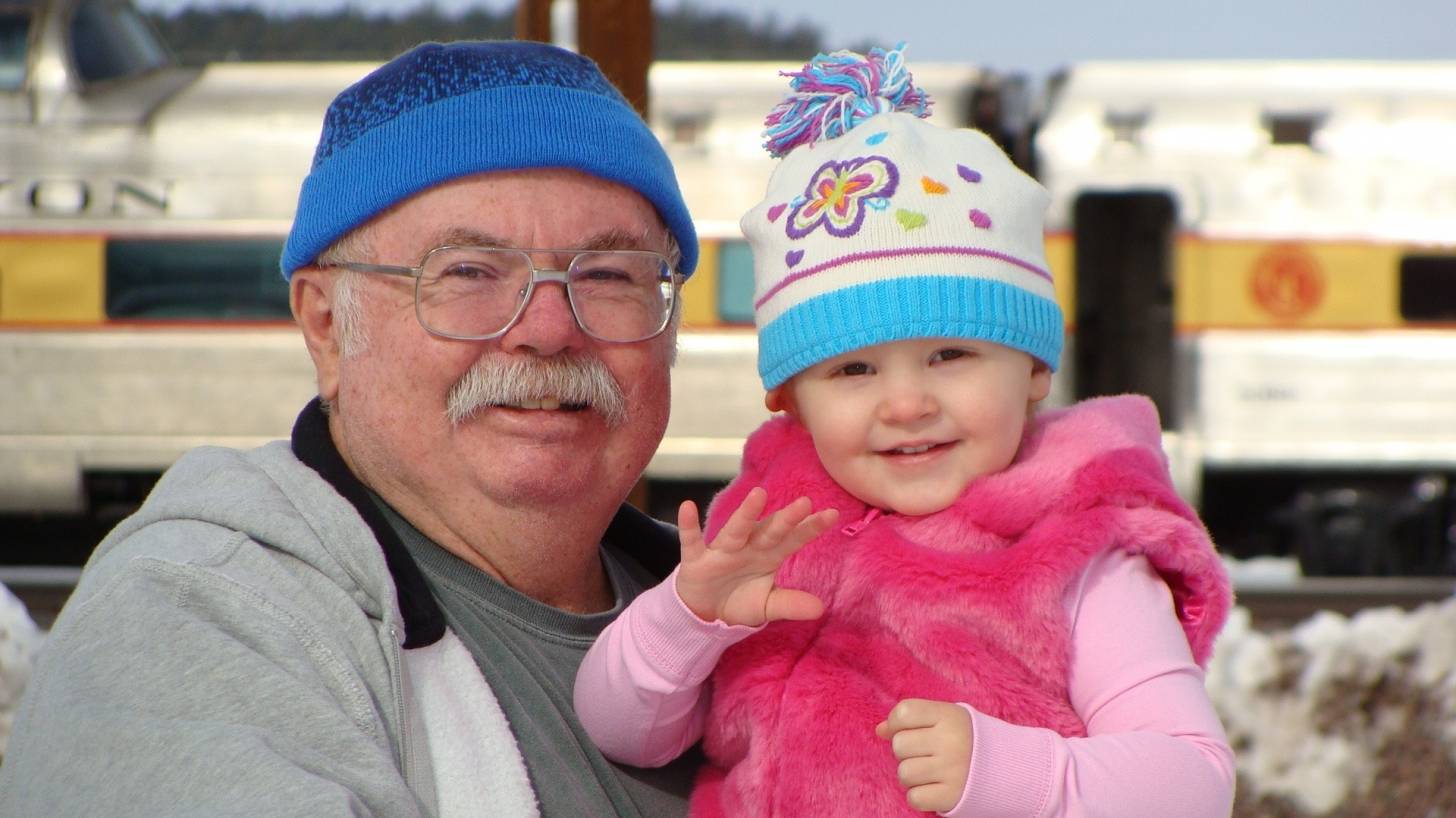 smiling grandpa with grand daughter