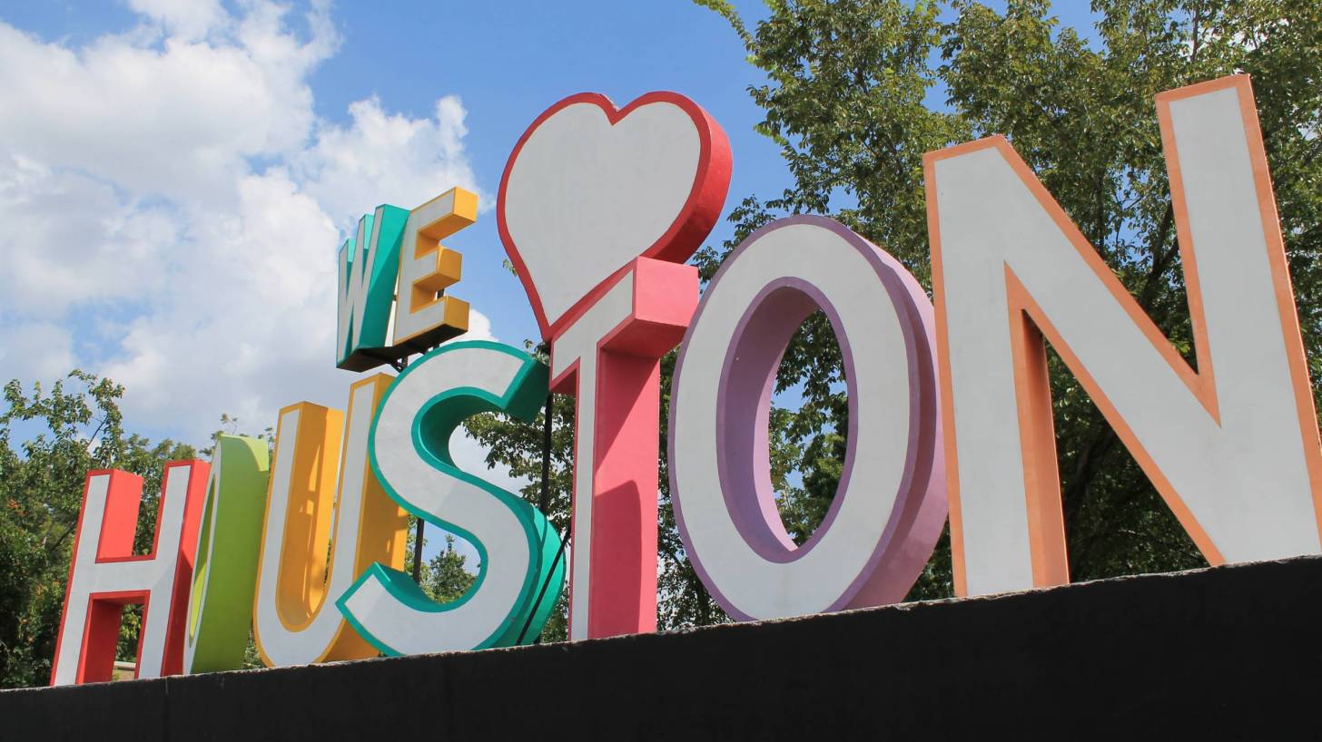 we love houston sign in bright colors and large letters