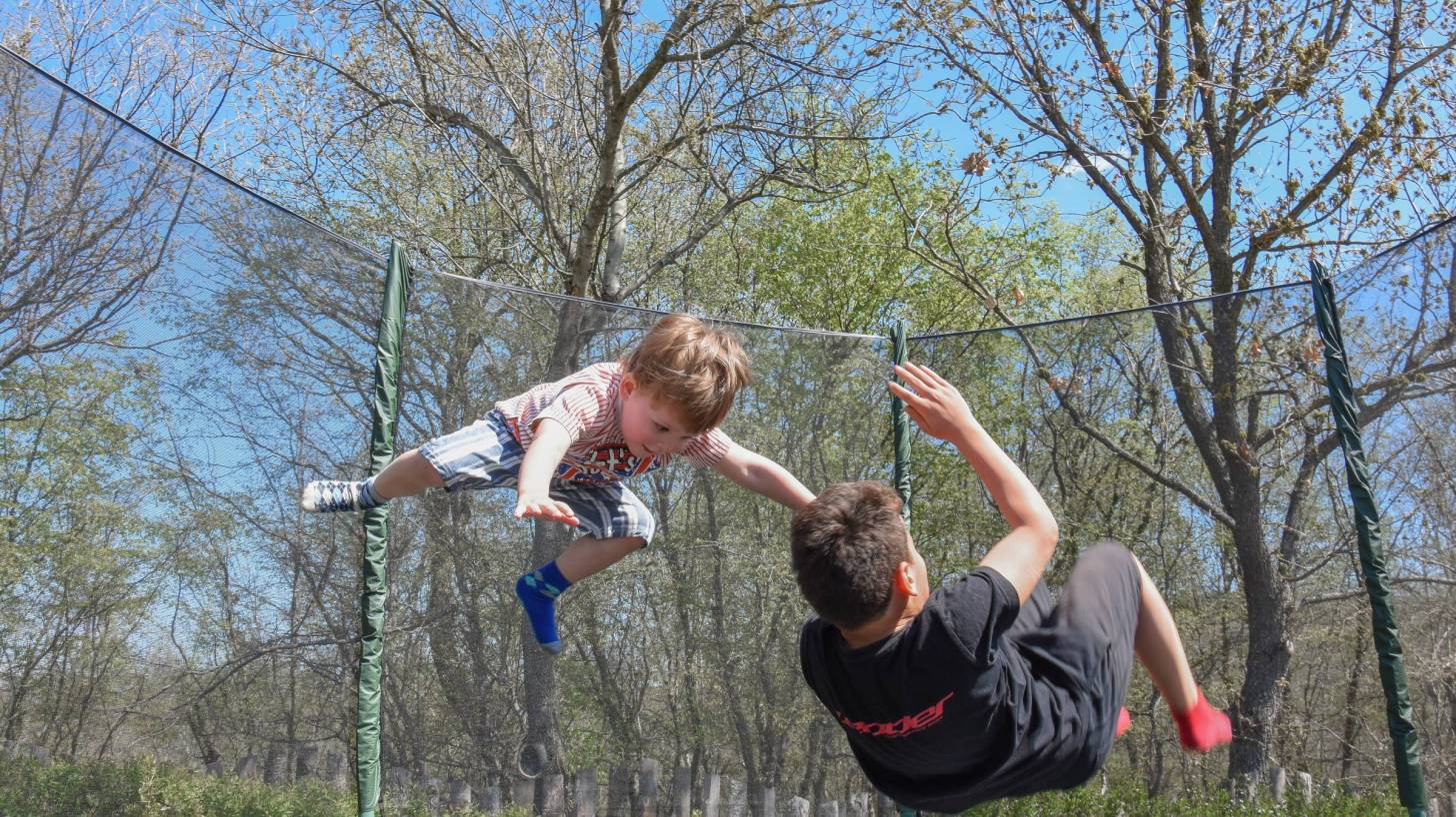 kids jumping on a trampoline