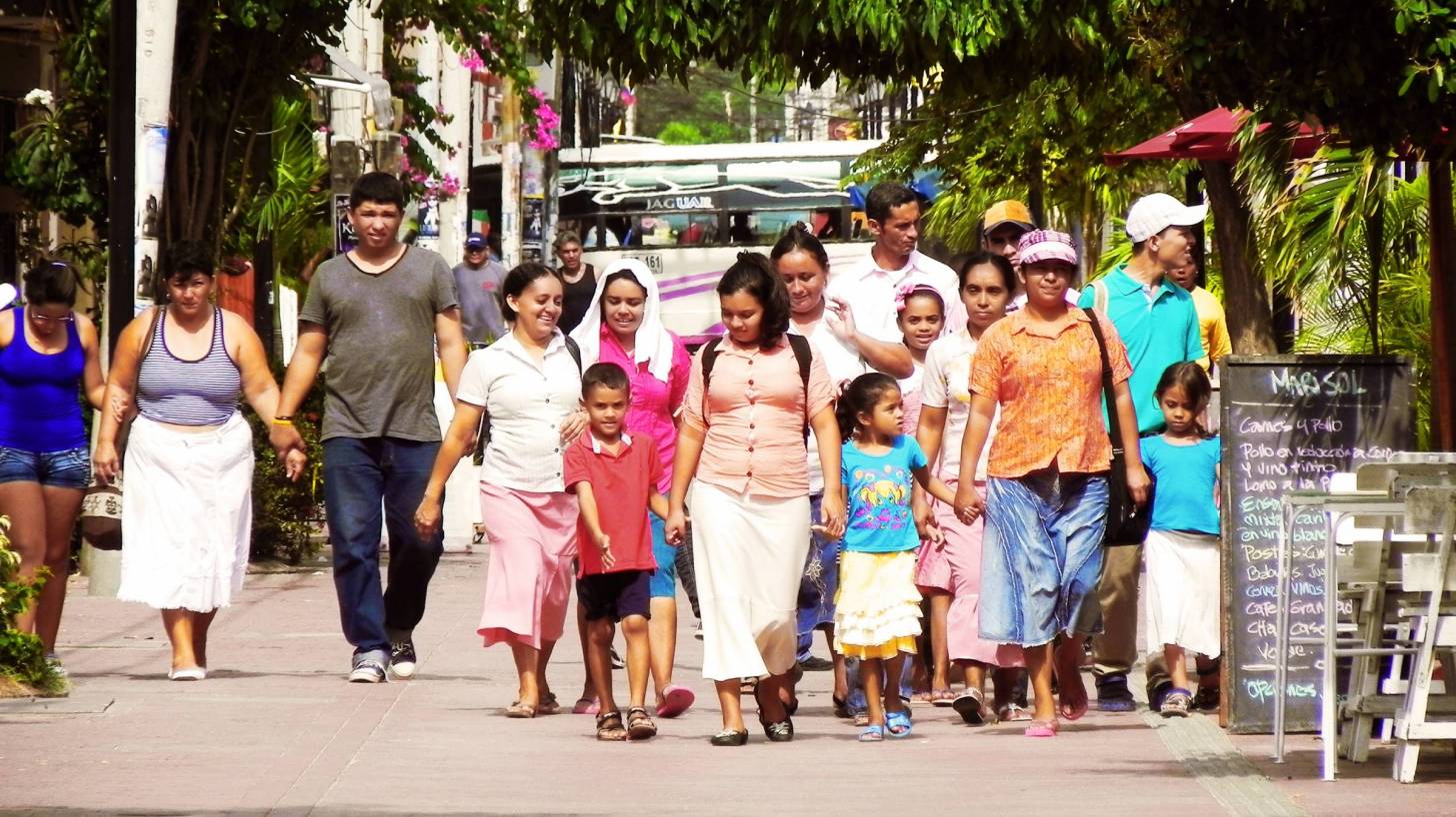 Latino family walking together