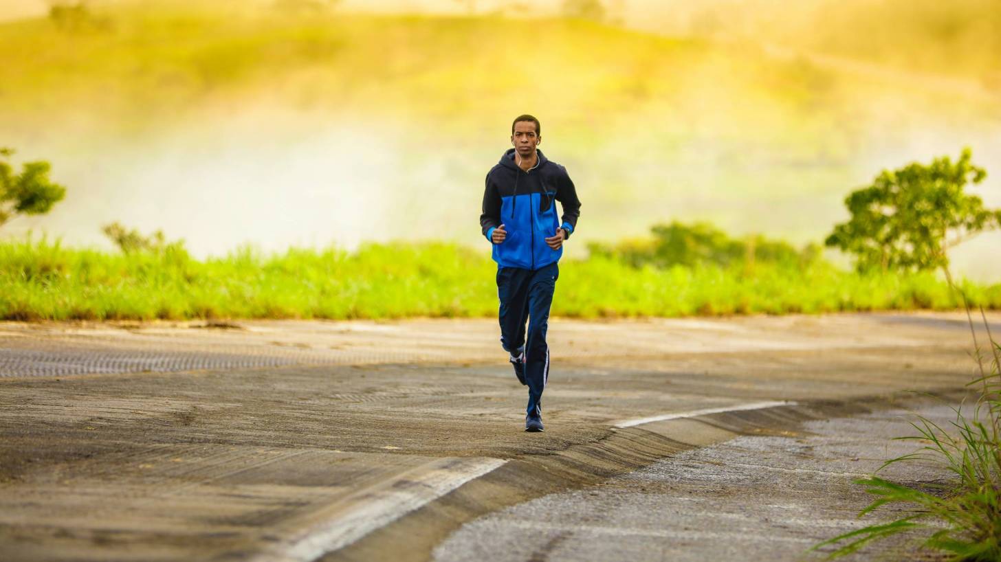 adult jogging on a lonely road