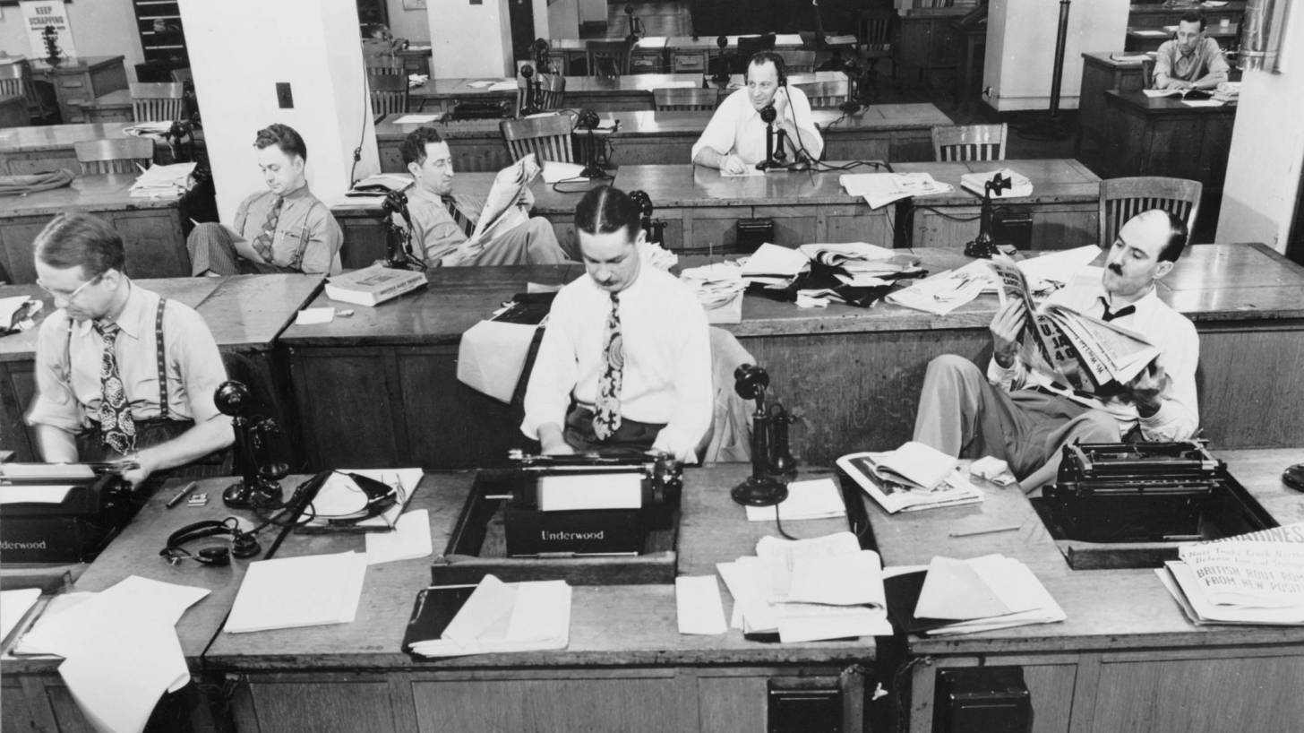 old photo of the NYT news room with older men