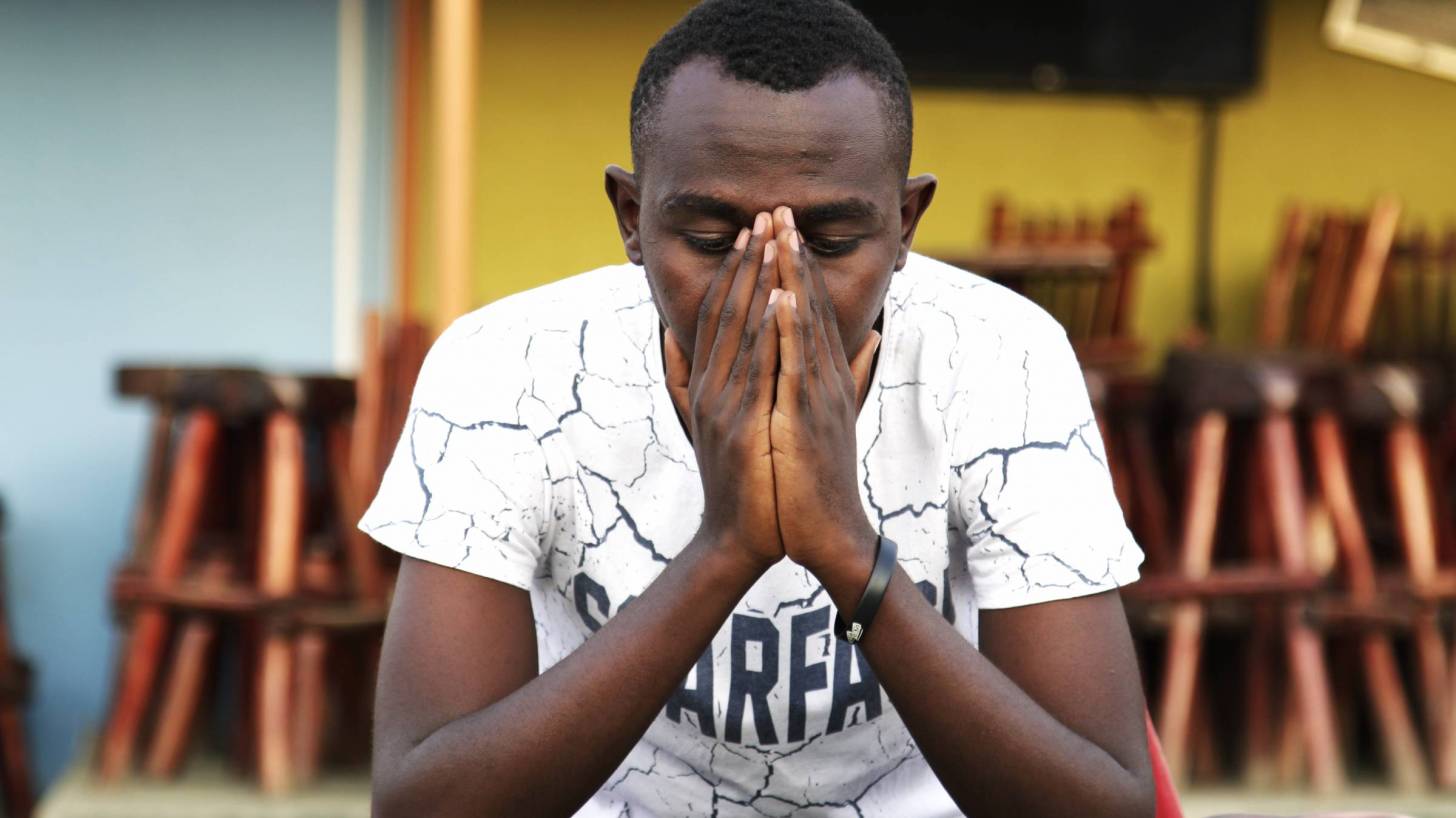 uganda man in prayer
