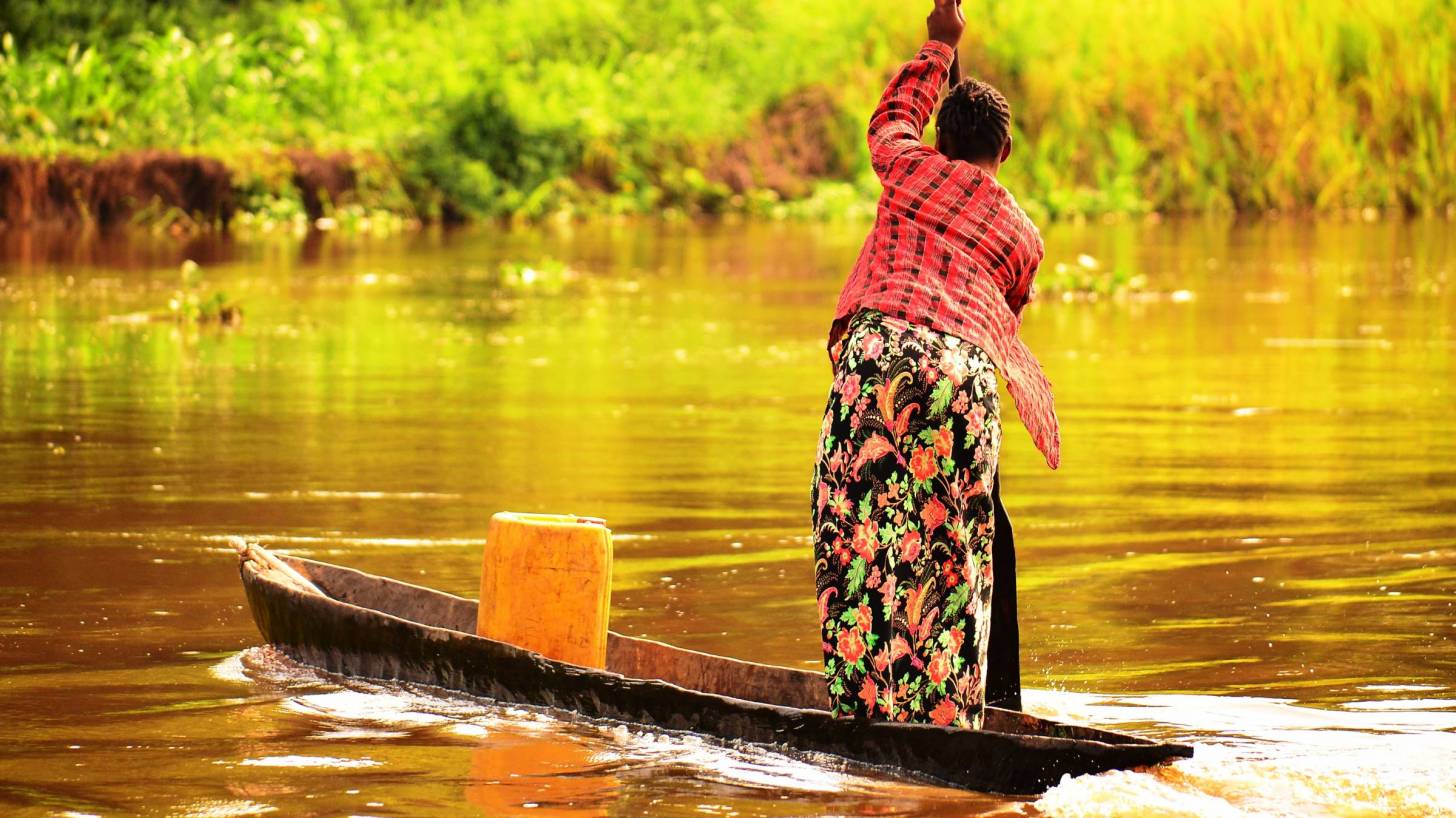 woman on river trading in africa 