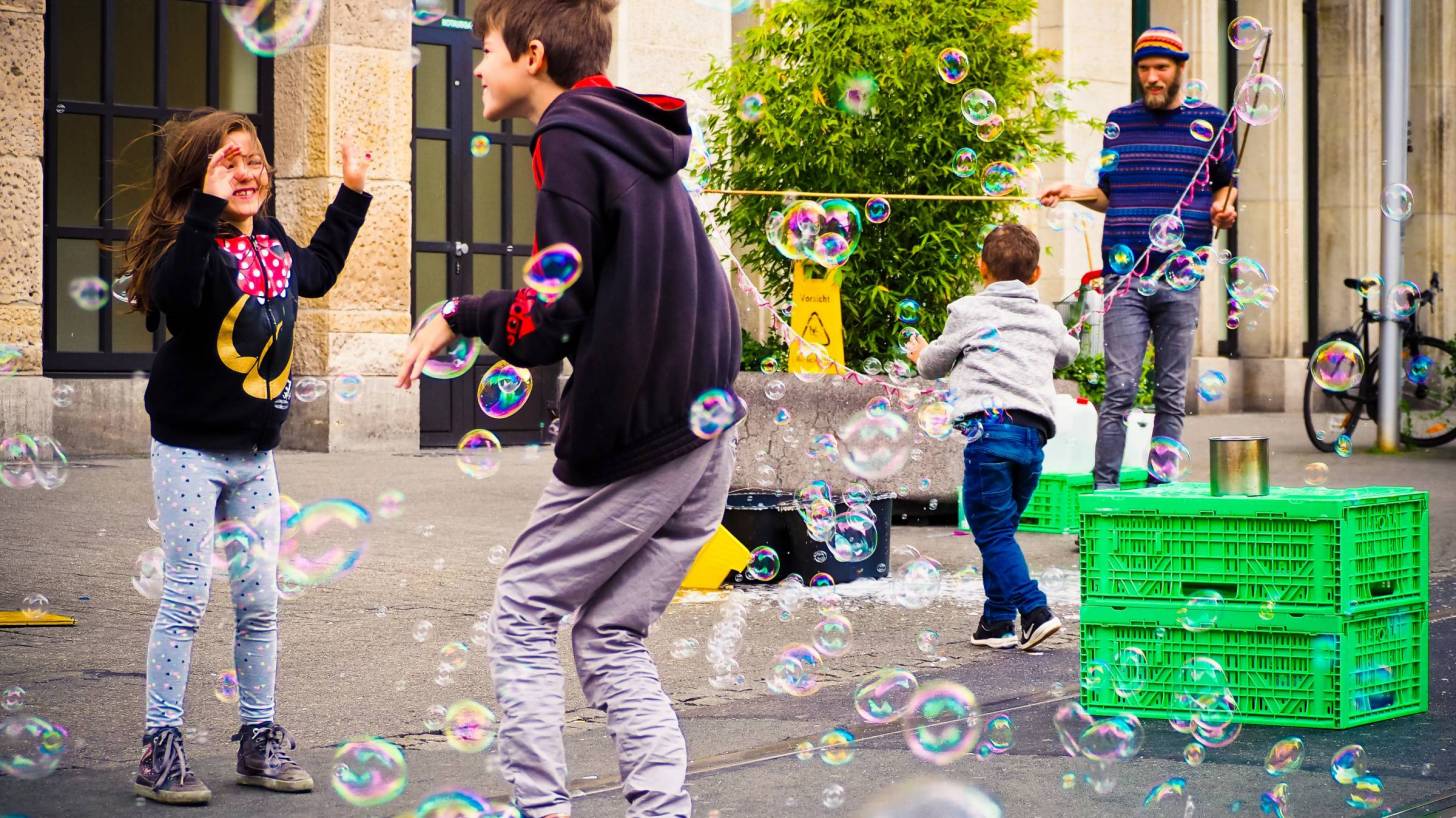 kids playing with bubbles