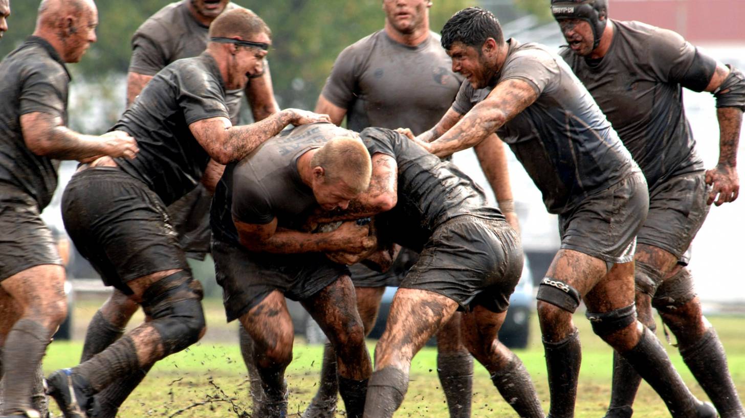 rugby players muddy