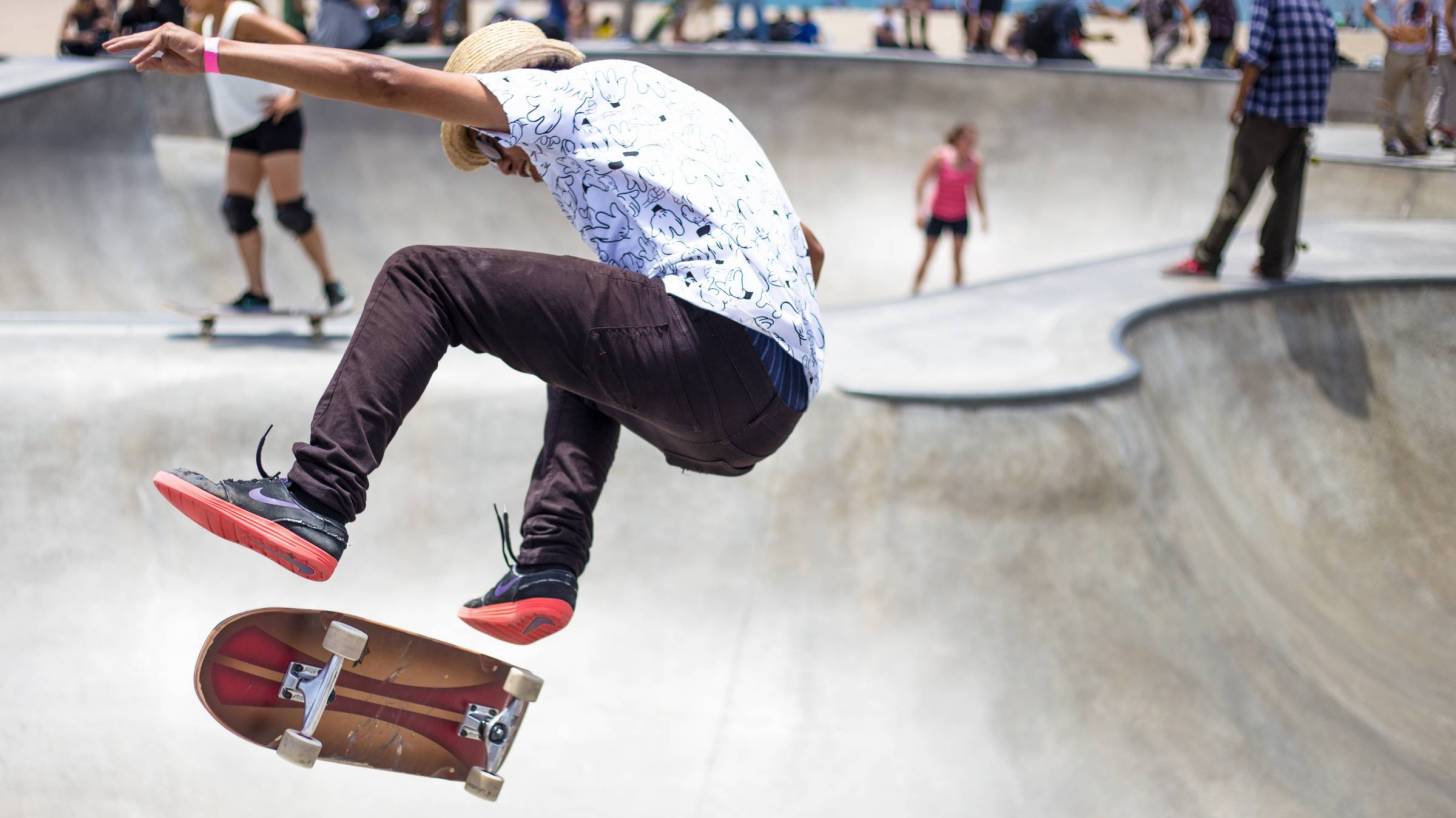 young people at skate park, risky moves