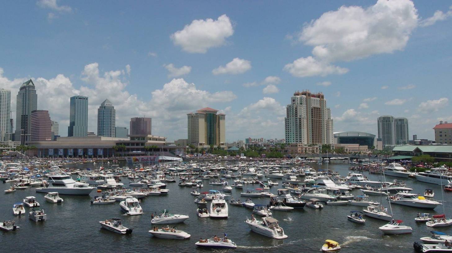 tampa bay filled with boats, looking towards the city skyline