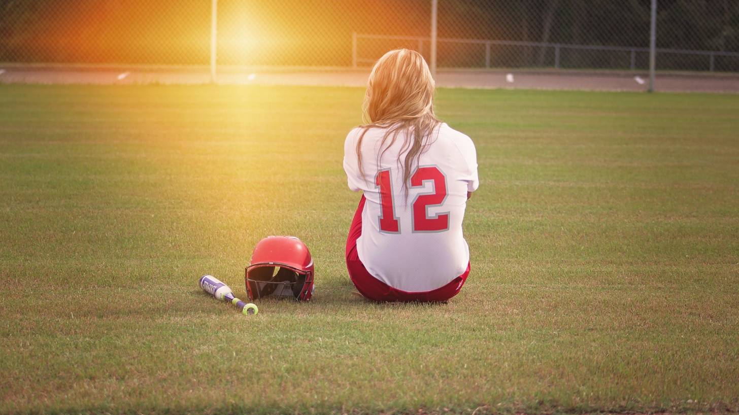 softball player in a field by herself