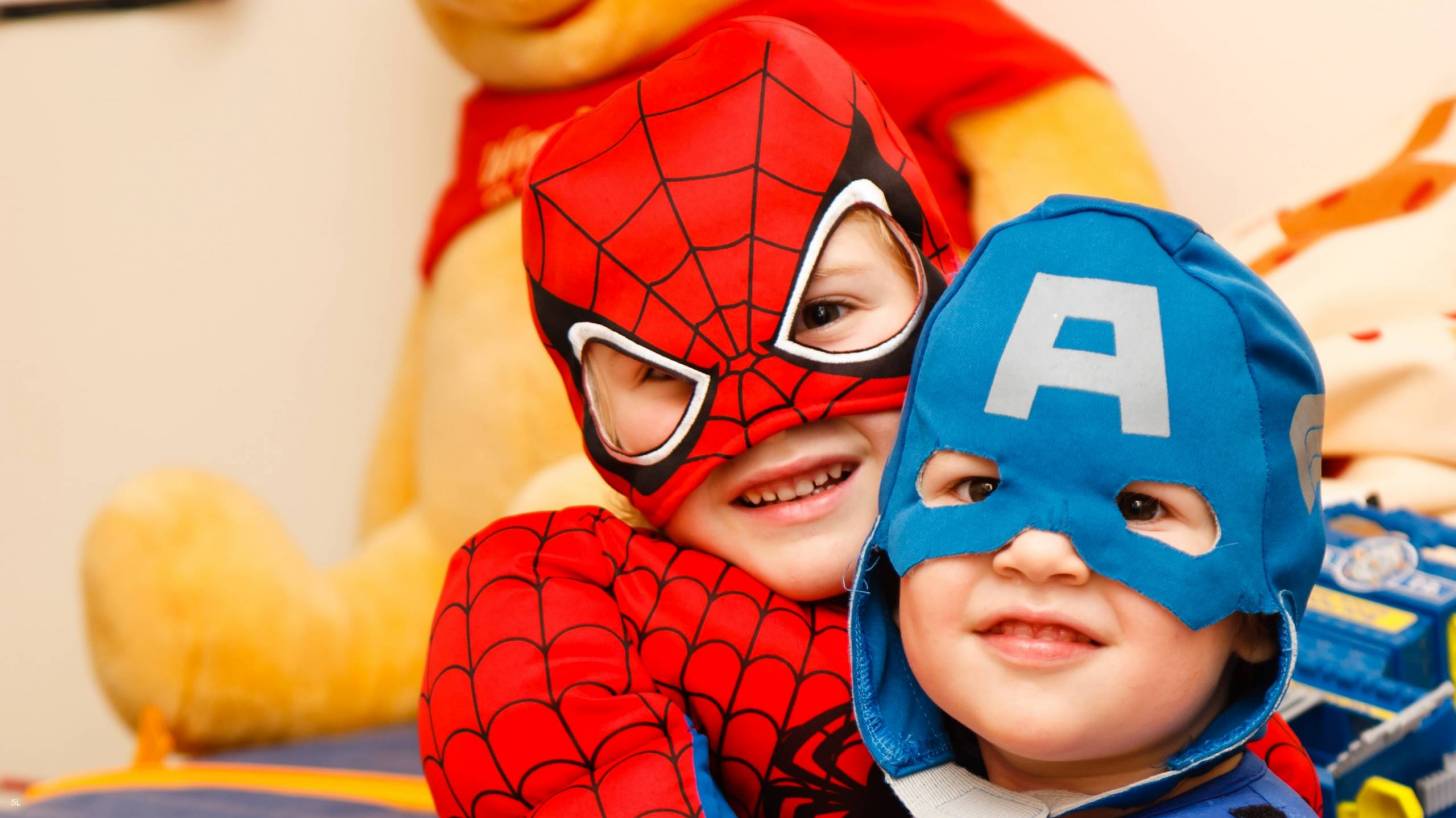 toddlers dressed as super heroes