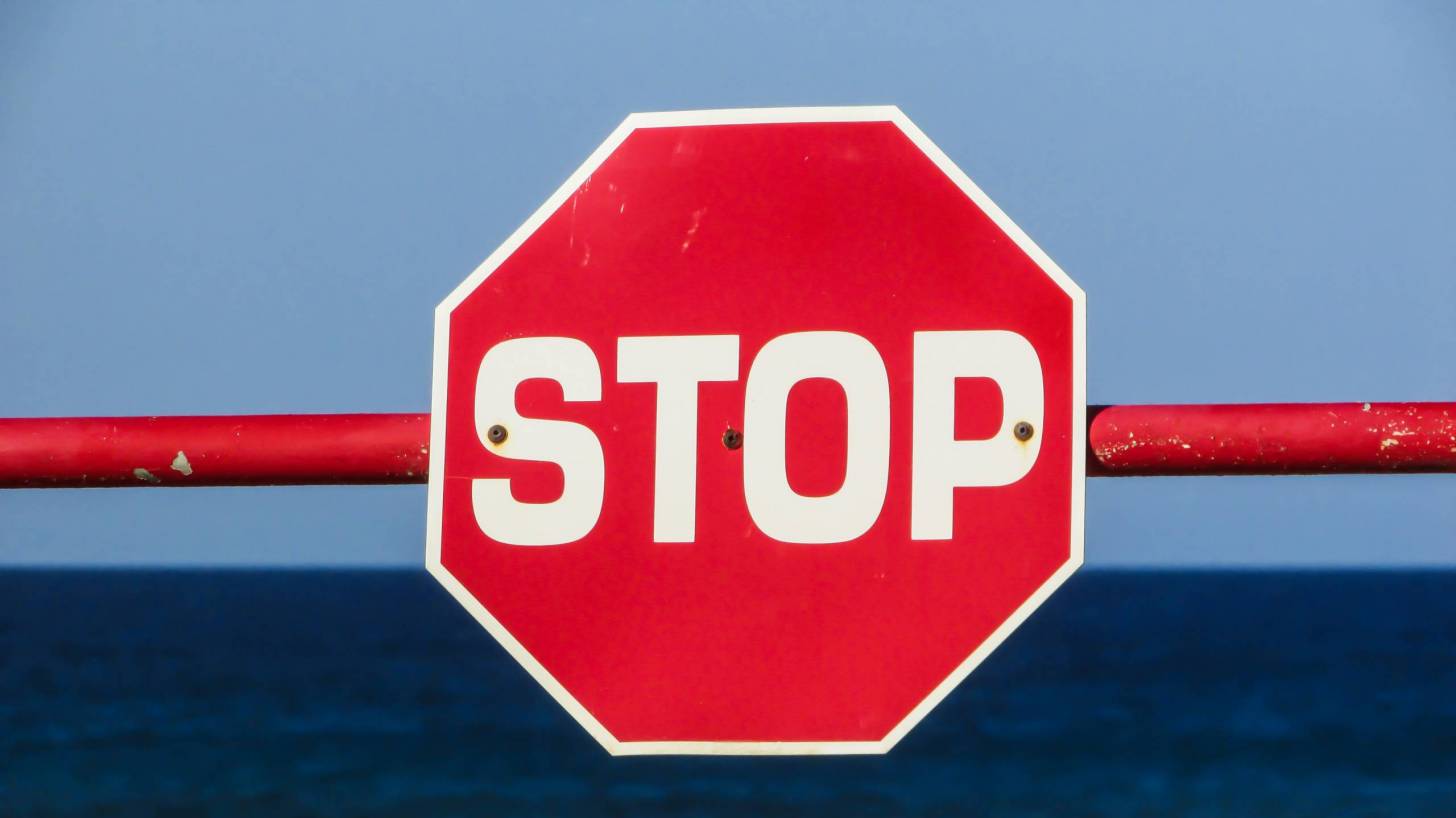 stop sign with bar
