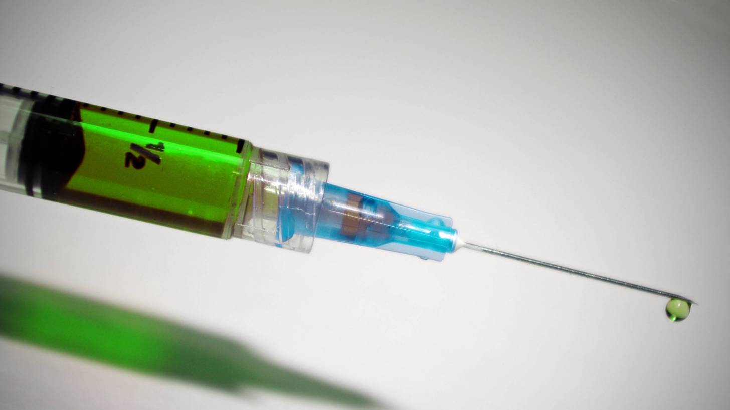 syringe with green medicine in it