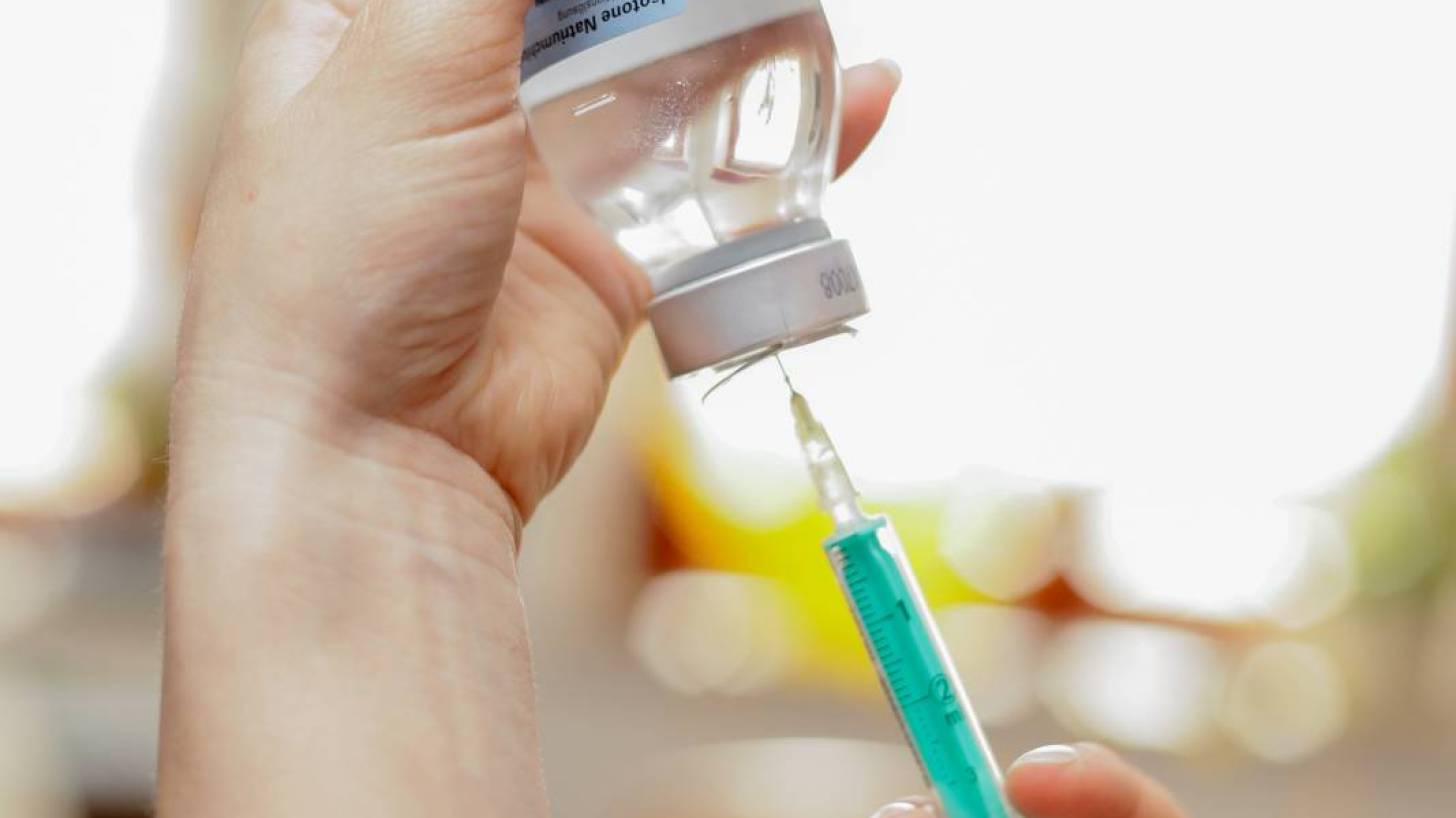 vaccine being filled from a vial