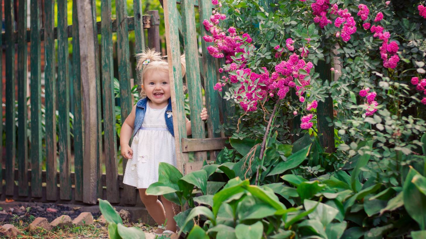 little girl in a garden
