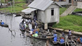 african village river with boats