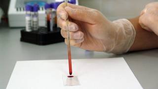 scientist working with blood