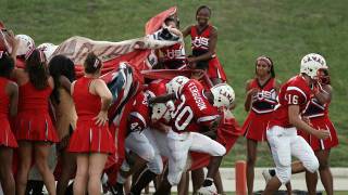 texas football team and cheerleaders