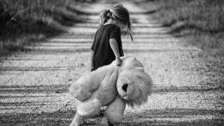 girl walkng teddy bear