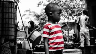 young african boy in red striped shirt