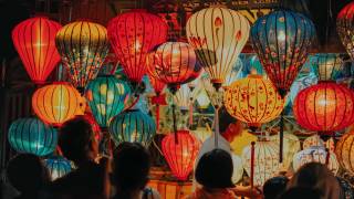 chinese paper lanterns lit in the sky