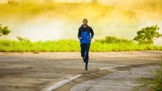 adult jogging on a lonely road