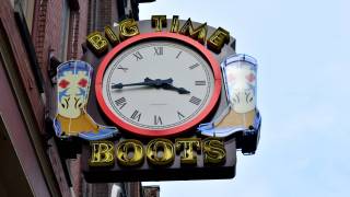 neon sign clock with boots