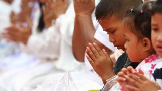 buddhist children in Laos praying