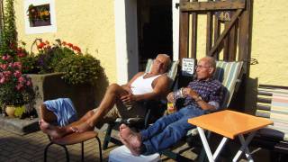 older men sitting in the sun