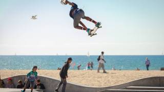 teens riding on skateboards by the beach