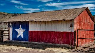 texas flag painted on the side of a barn